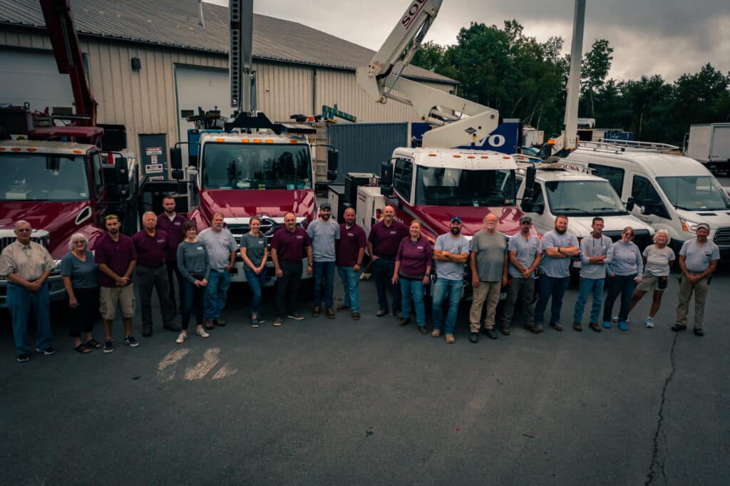 Commercial photography drone photo of bucket trucks and sousa signs team video production