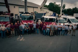 Commercial photography drone photo of bucket trucks and sousa signs team