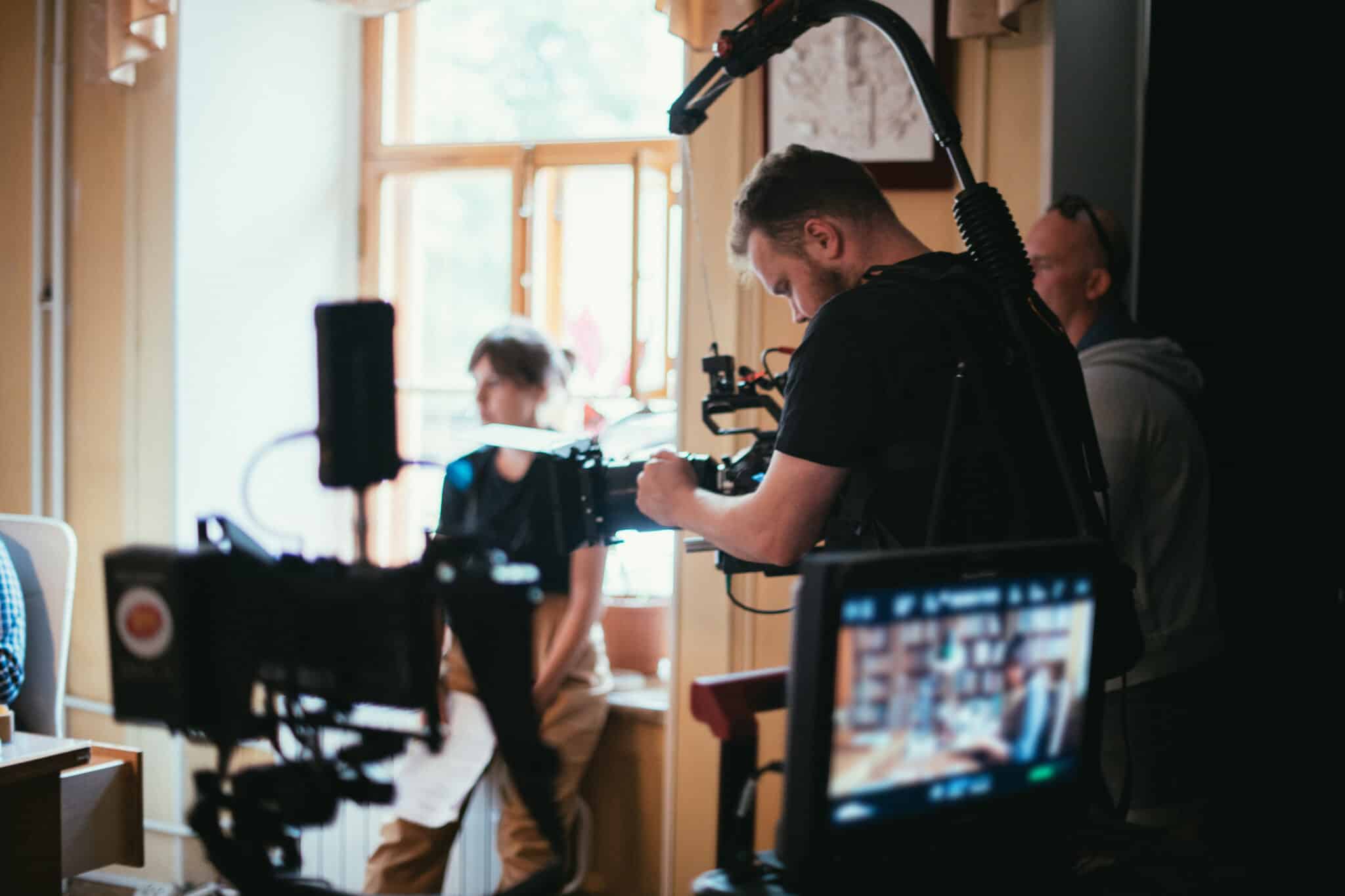 Director of photography filming a commercial on set