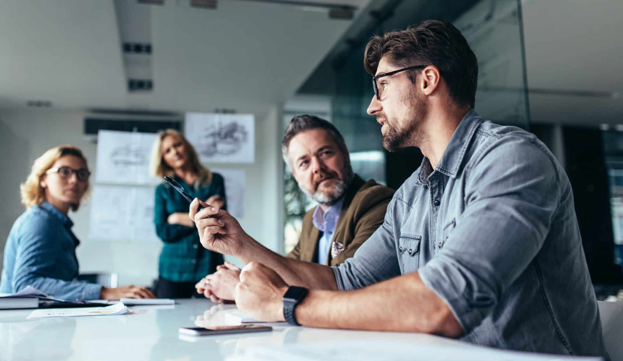 people talking at a table cinematic marketing