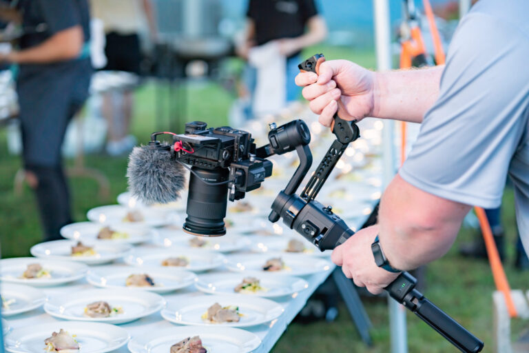 lifi media video production companies near me, videographer films an outdoor dining experience