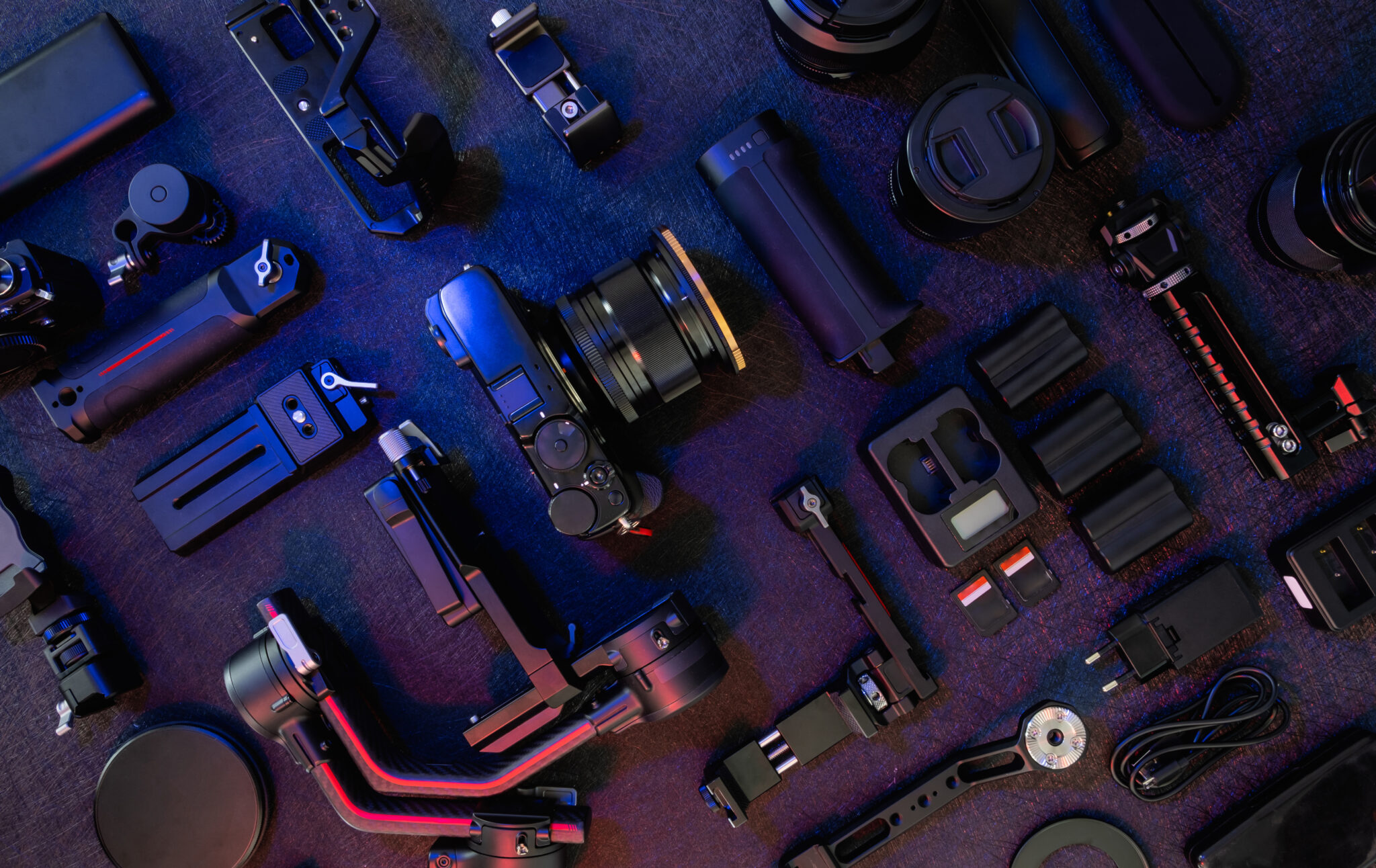 Top view of a workspace with photographer using digital camera gimbal