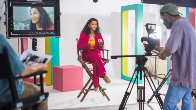 lifi media production documentary filmmaking, a documentary crew films a woman giving an interview