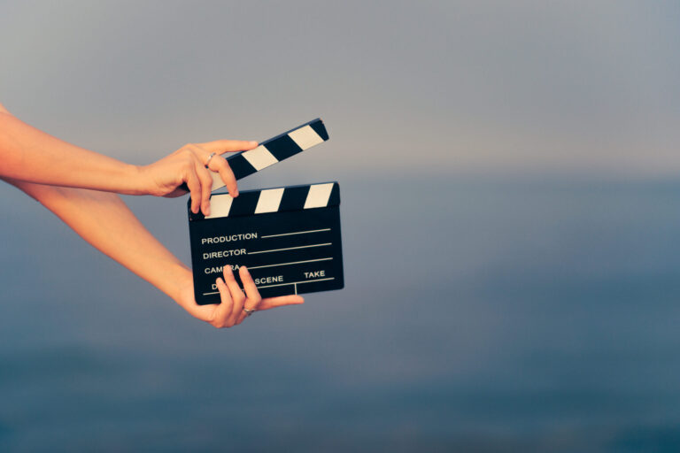 lifi media production documentary filmmaking, person holding clacker