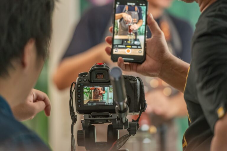 lifi media production, social media video, back screen video recording by videographer record video clip by camera and smartphone to online social internet live. vlogger watching recording clip streaming online a man make a cup of coffee drip .