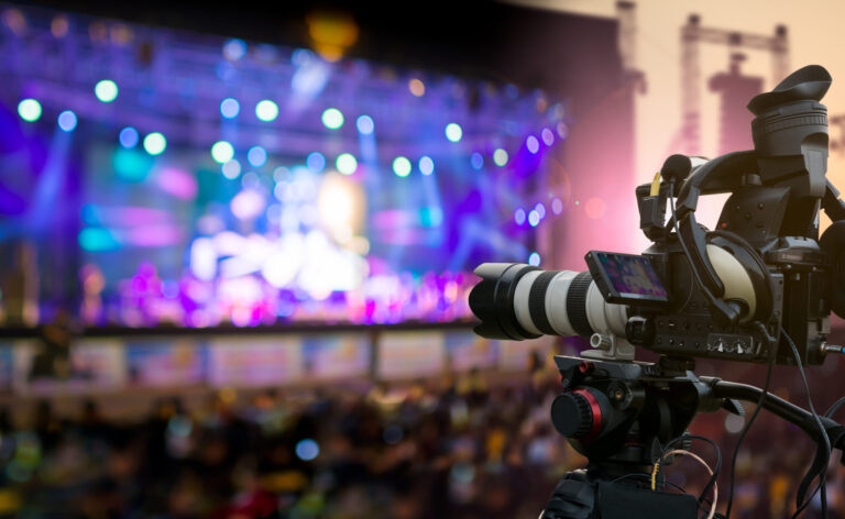 LiFi Media Production Corporate Video Trends 2025 Video production covering event on stage by professional video camera in outdoor concert at sunset