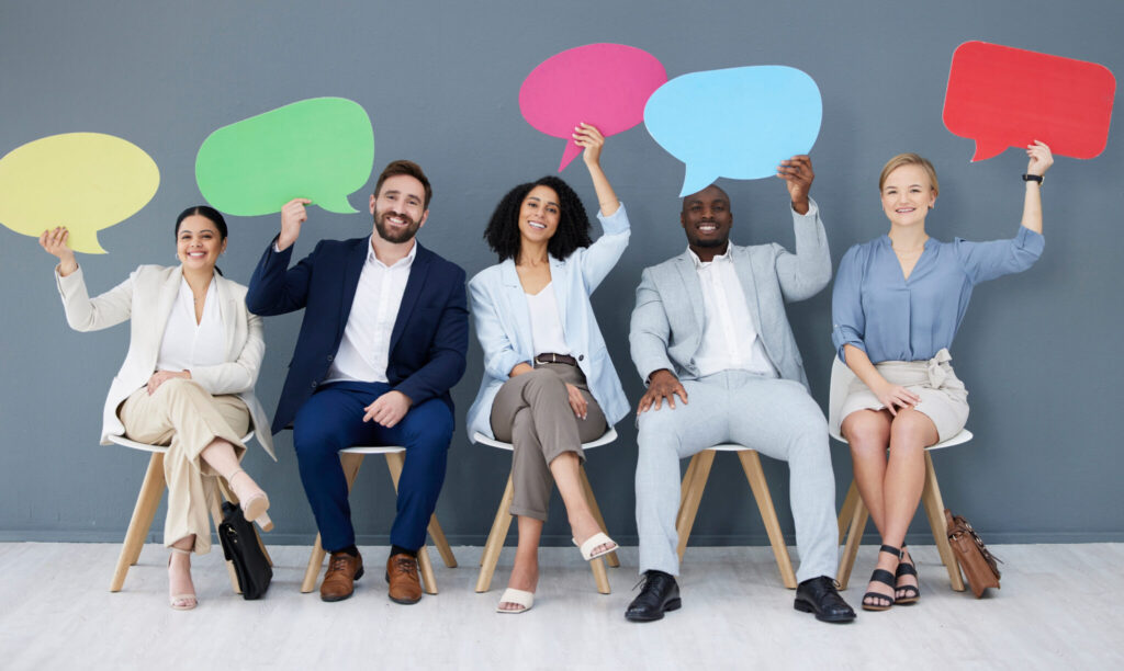 LiFi Media Production Testimonial Video Production, Diversity, business people and speech bubbles for social media, recruitment and feedback in workplace. Multiracial, happy employees and coworkers with happiness, interview or collaboration for survey.