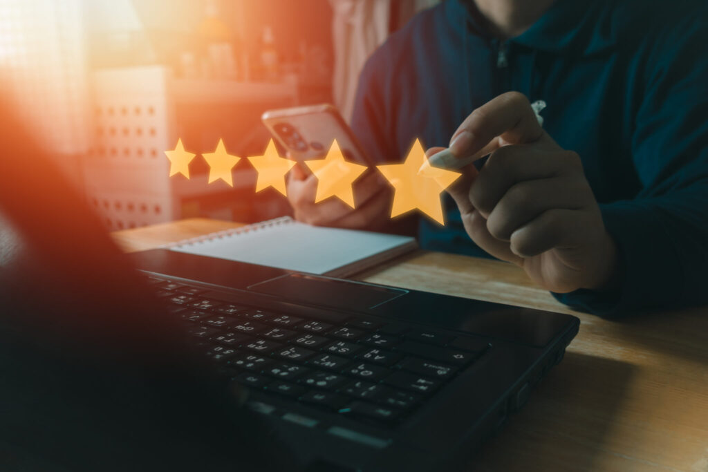 LiFi Media Production Testimonial Video Production, Customer review good rating concept people use a laptop computer and press five star rating for positive customer feedback testimonial survey, satisfaction five star icon on visual screen.