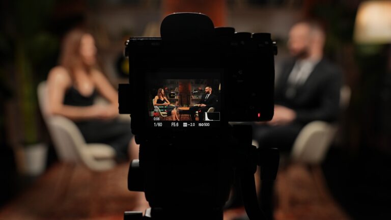 Lifi media production brand videography two experts have a dynamic conversation about business a man and a woman tell stories in a modern stylish loft style podcast studio recorded on camera lifi media production new england's video production experts