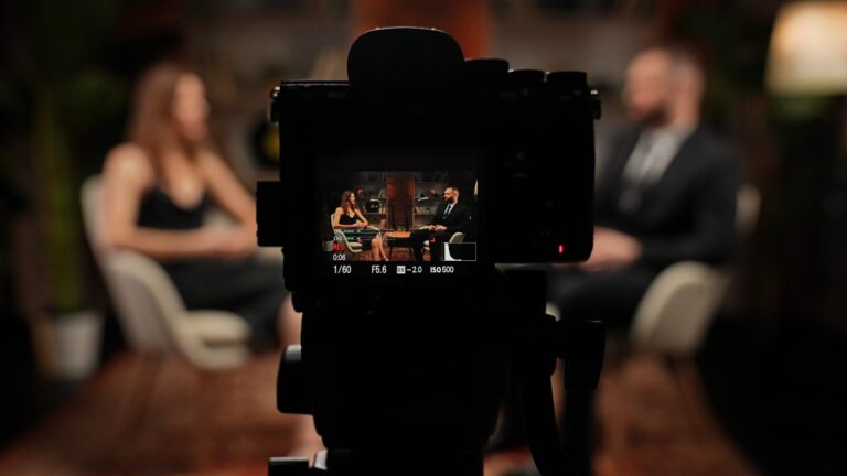 LiFi Media Production Brand Videography, Two experts have a dynamic conversation about business. A man and a woman tell stories in a modern, stylish loft-style podcast studio. Recorded on camera.