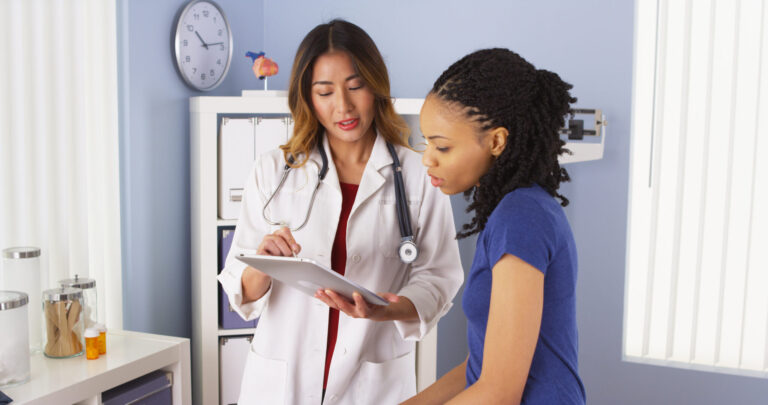 LiFi Media Production healthcare video production, African American patient explaining issues to Asian doctor using tablet