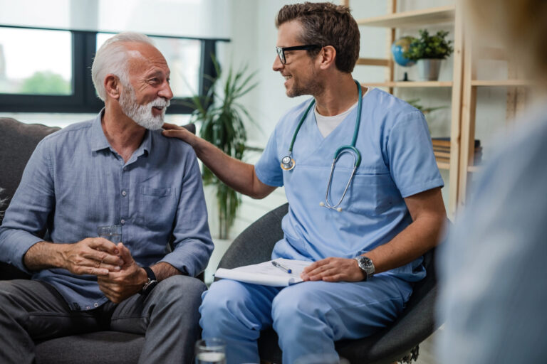 LiFi Media Production healthcare video production, Happy doctor talking to senior male patient while being in a home visit.