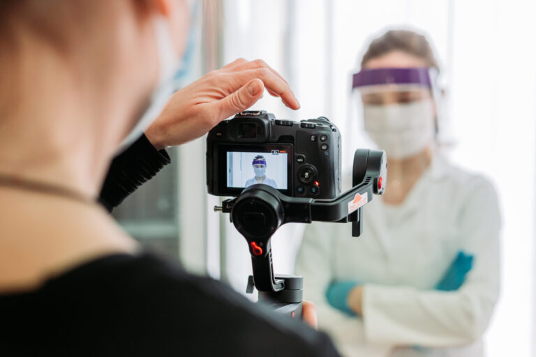 LiFi Media Production healthcare video production, Indoors shooting in the hospital of female medical worker in coronavirus protection suit. Pandemic work