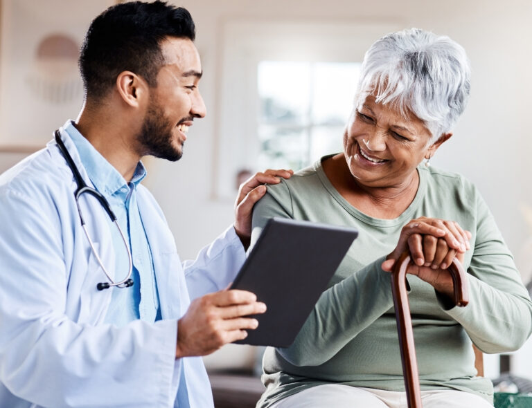 Lifi media production healthcare video production services shot of a young doctor sharing information from his digital tablet with an older patient lifi media production new england's video production experts