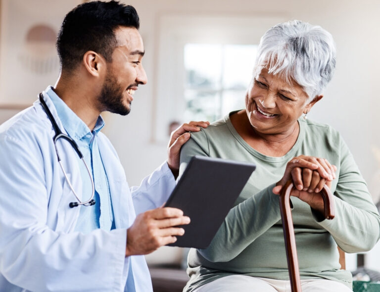 LiFi Media Production healthcare video production services, Shot of a young doctor sharing information from his digital tablet with an older patient.