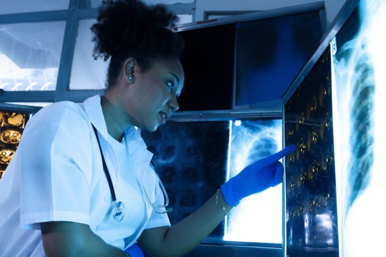 LiFi Media Production healthcare video production services, Female medical radiologist doctor looking head and brain x-ray film before surgery in lab office at hospital. Healthcare and education.