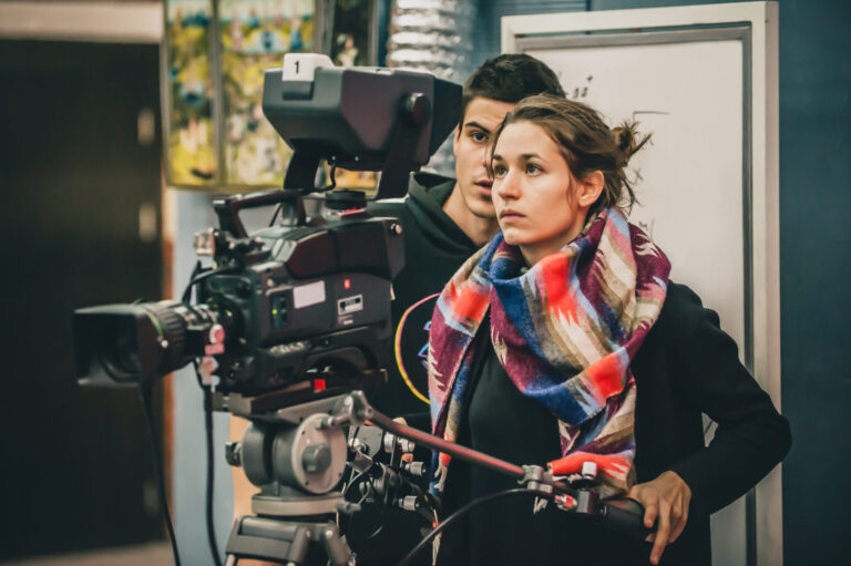 LiFi Media Production Documentary Video Production, Behind the scene. Cameraman and assistant shooting the film scene with camera in film studio
