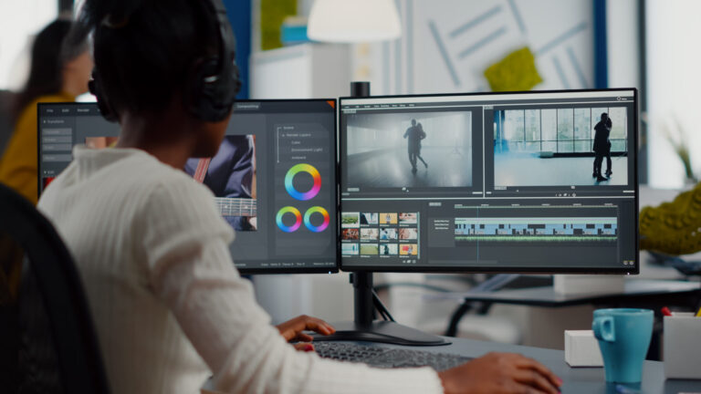 LiFi Media Production Documentary Video Production, video editor working with footage and sound, editing new project cutting film montage sitting in modern agency office. Woman using computer processing movie in post production software